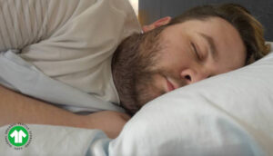 The Best Cotton sheets: An image of a man sleeping on his side with the Birch Organic Sheets
