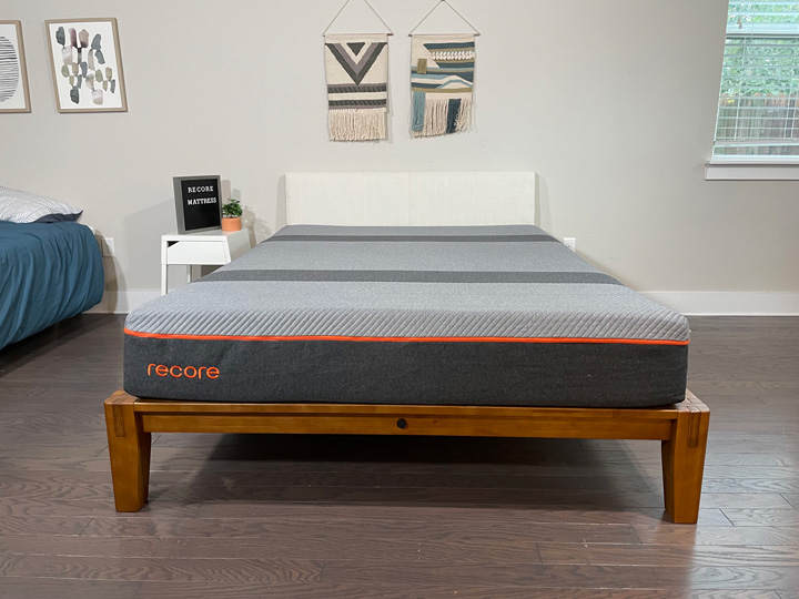 The Recore mattress sits on a Queen bed frame in a sunny bedroom.