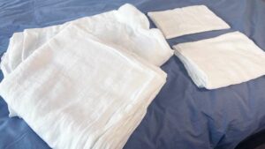 An image of the four pieces that come in the Saatva Linen Sheet set.