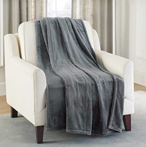 An image of the Brookstone heated throw blanket draped over a chair.